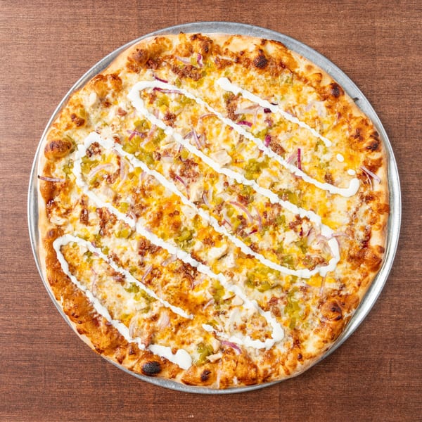 Grampie's Pizzeria's chicken bacon ranch pizza, topped with red onions and green peppers.
